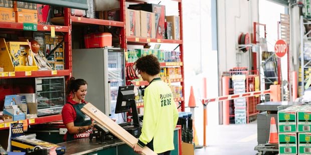 Bunnings Team Member serving a customer.