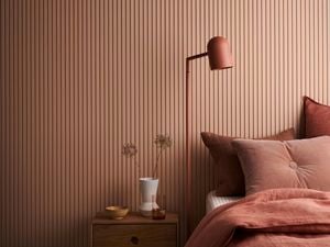 Bedroom with bed, lamp and coffee table. Batten 25 design in Dulux Clay Court.
