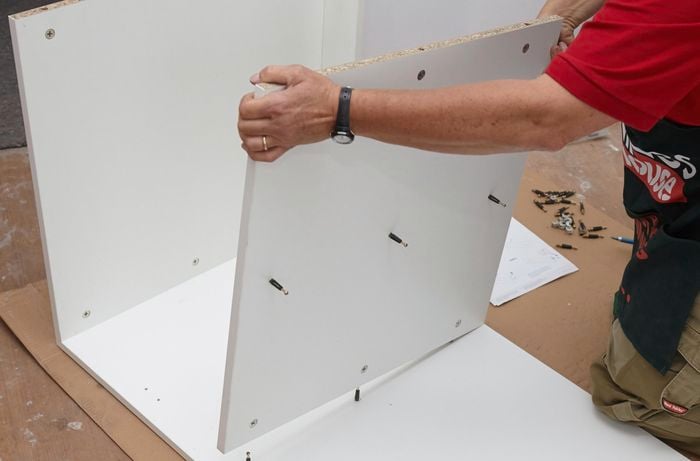 Attaching fixed shelf.