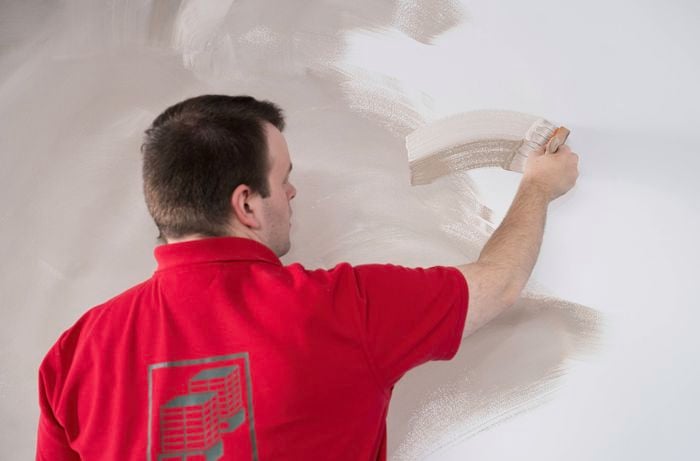 Apply the limewash effect with a crisscross or swirling motions