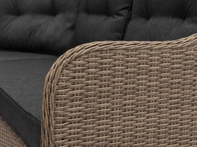 Close up of the armest of a wicker outdoor sofa