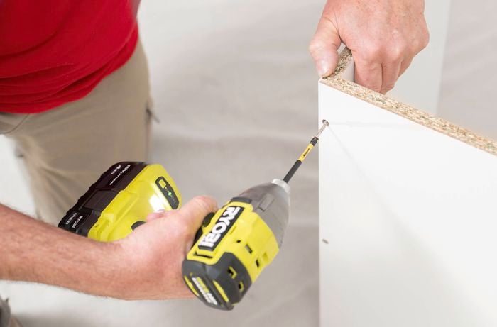 Attach the top and bottom panels using a power drill