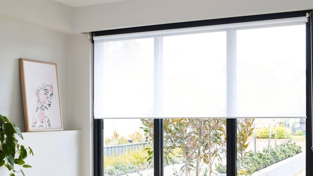 Indoor corner with painting facing a window with blinds