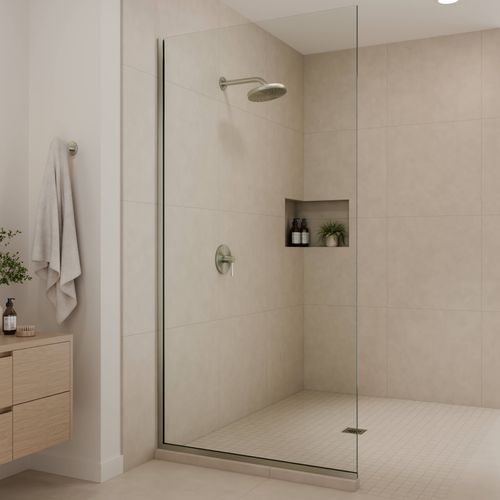 Corner shower enclosure with brushed nickel hardware, clear glass, and timber vanity unit.