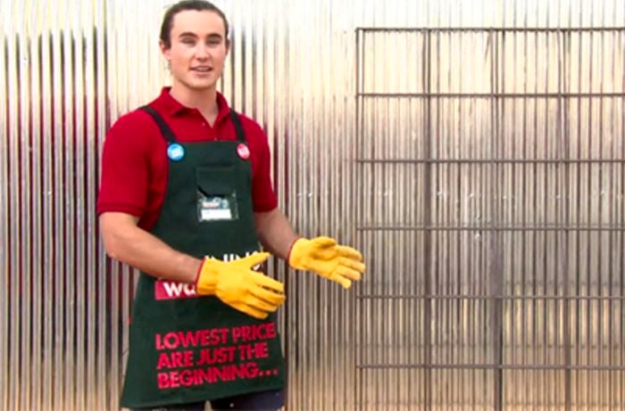 A Bunnings team member with two metal frames