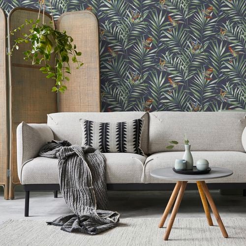 Birds on leaves wallpaper in living space.