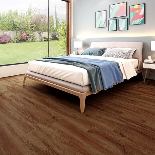 Bedroom with bed and timber-look flooring