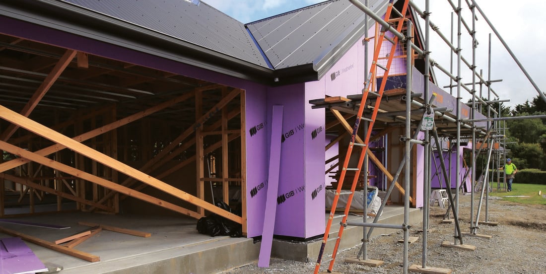 House under construction with GIB Weatherline cladding and scaffolding