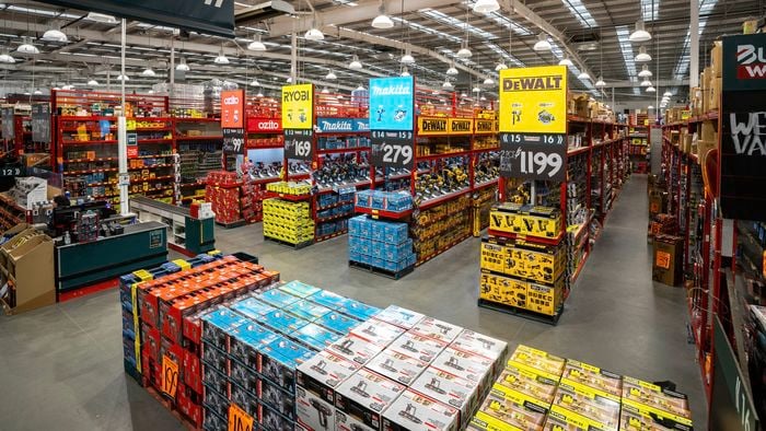 Interior of the Bunnings Carrum Downs Tool Shop with wide aisles of power tools, branded displays, and stacked tool kits under warehouse lighting.