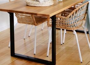 Dining table with rattan chairs.