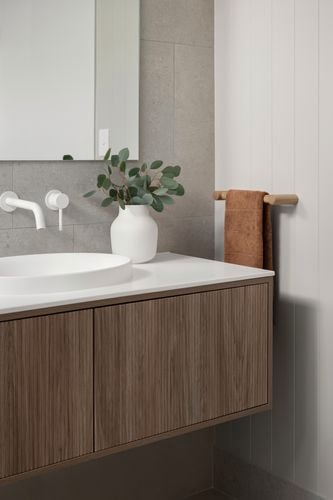 Bathroom vanity, sink and mirror in view with a wall painted with Coloursmith