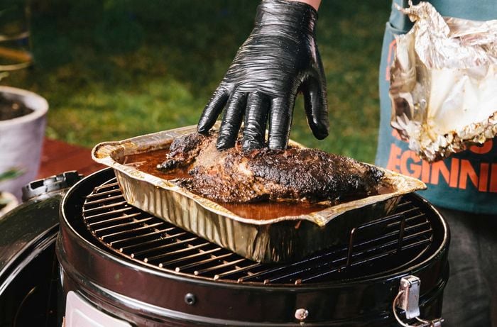 Cooked pork shoulder in baking tray