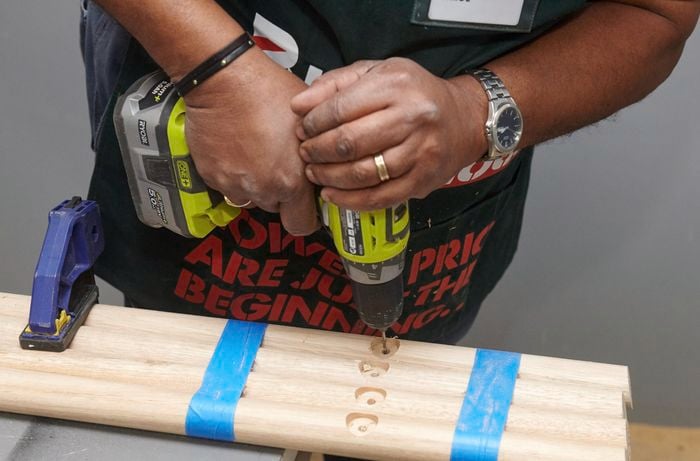 Holes being drilled into stool legs
