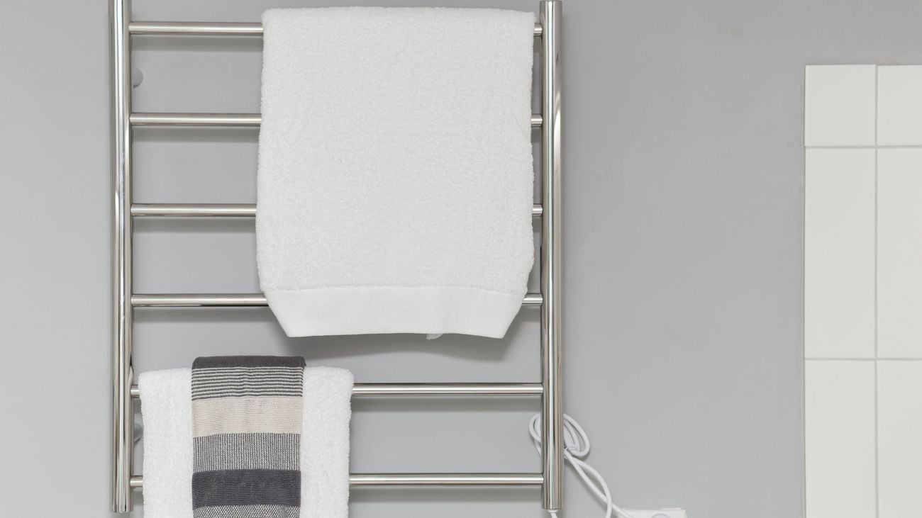 Heated towel rail with towels hanging.