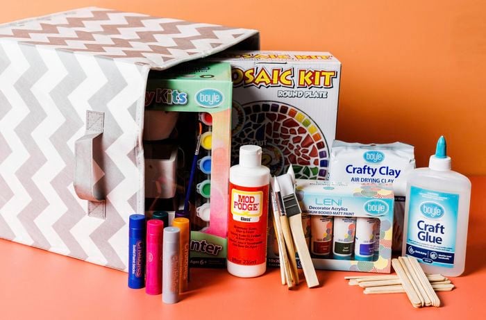 Close up of a storage box filled with kids craft products.
