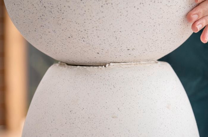 Join pots bases together with adhesive that works well with the material.