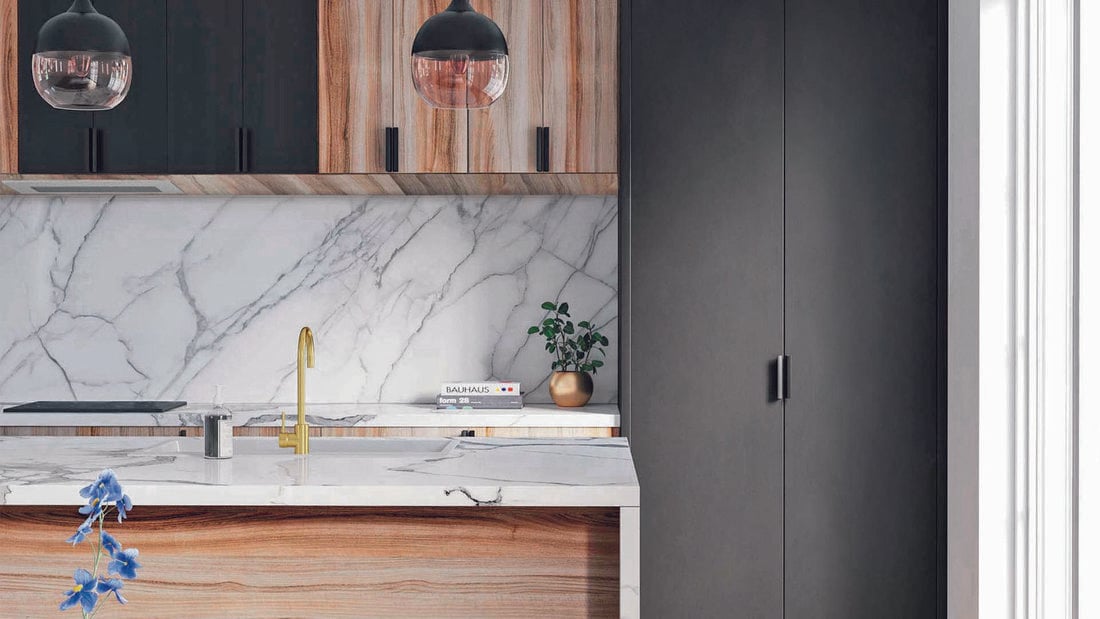 Close up of Kaboodle marble-look kitchen benchtop, sink and brushed brass sink mixer
