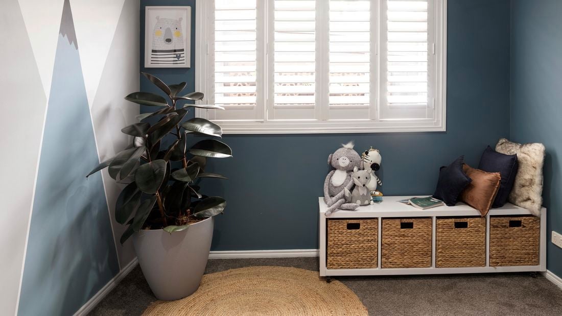White plantation shutters in a house interior.
