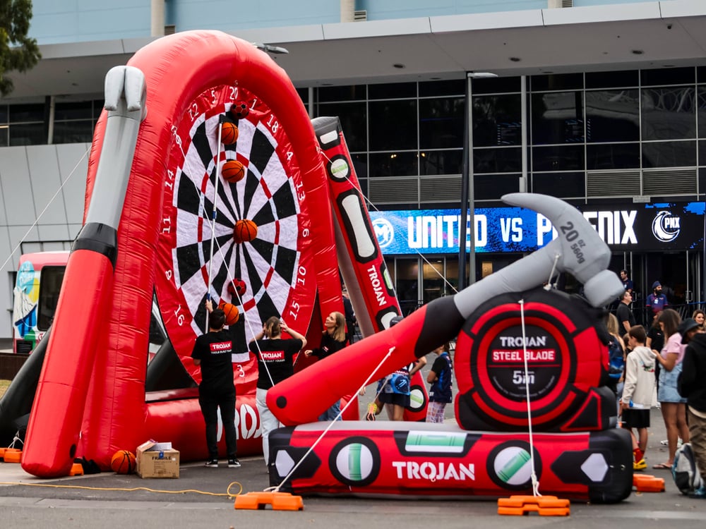 Trojan giant dartboard where people threw a basketball instead of darts