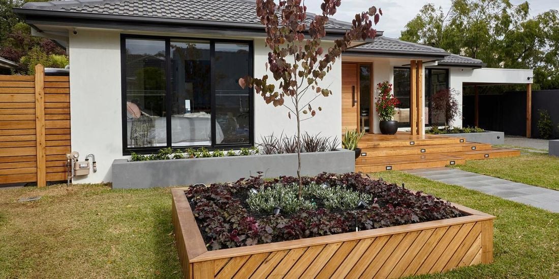 Front garden of a house with garden path and planter box.