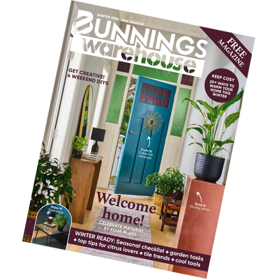 Angled Bunnings Warehouse Winter 2026 magazine cover showing a styled entryway with a teal front door, plants, and furniture, highlighting DIY projects and winter home ideas.