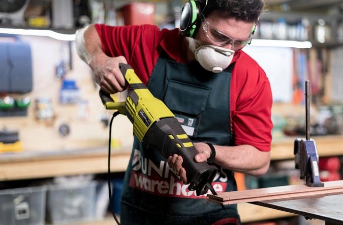 Bunnings team member showing how to us a reciprocating power saw