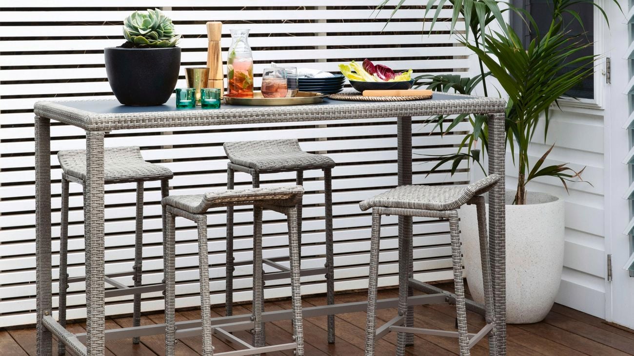 Marquee ‘Bayfield’ wicker bar table and bar stools on a deck.