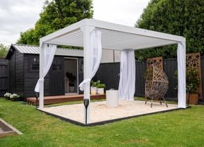 outdoor space with sheer curtains, egg chair