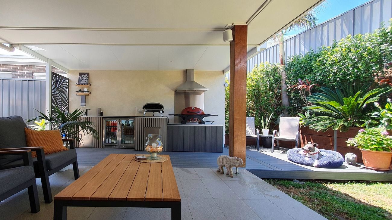 Outdoor alfresco  entertaining area, showcasing outdoor lounge setting, bbq and outdoor fridge.
