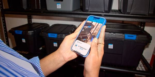 App being used to scan the qr code in order to place items in storage