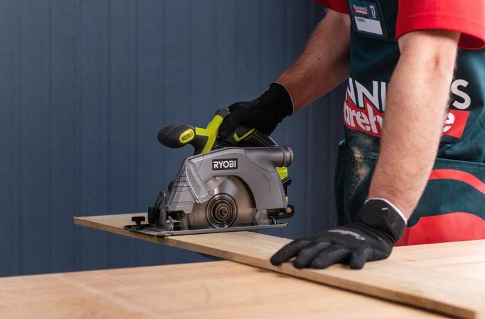 Cut timber with a circular saw.
