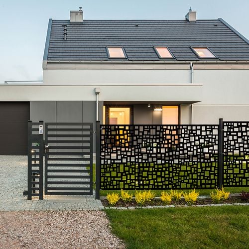 Front fence to home with decorative, patterned screen as fence