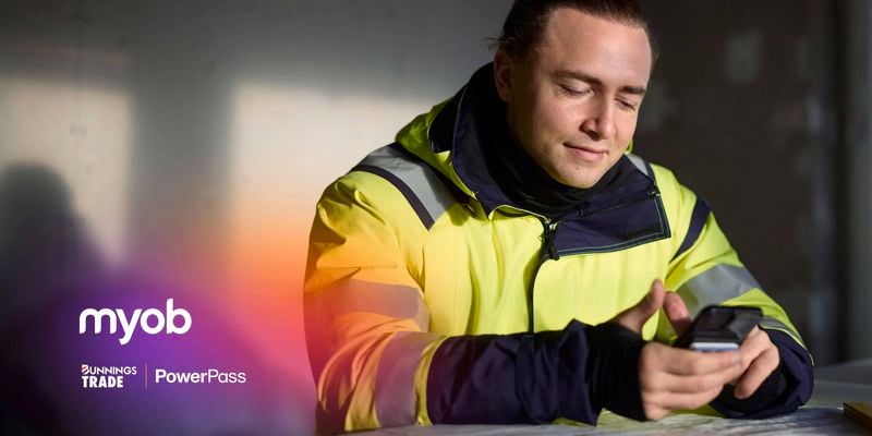 Tradie on MYOB app on his phone.