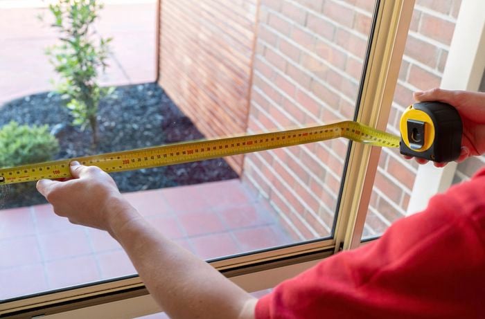 Measure the window dimensions using measuring tape