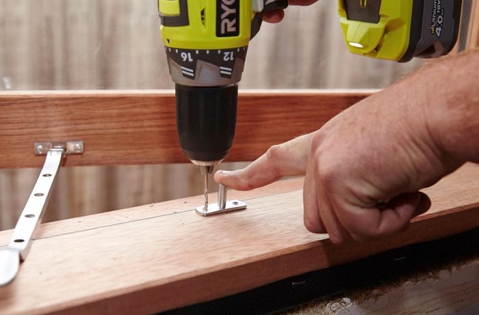 Drilling a hole for a window stay fixer on a window sill