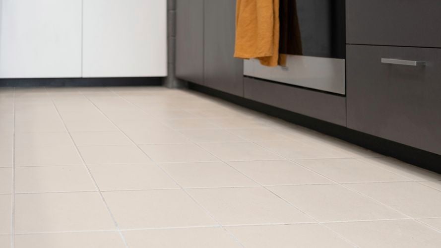 Light coloured tile kitchen needs grout cleaning.