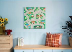  Nostalgic wall art featuring a road map with houses and trees