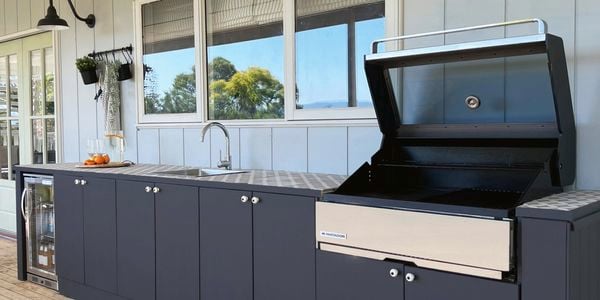 outdoor kitchen set up with a bbq