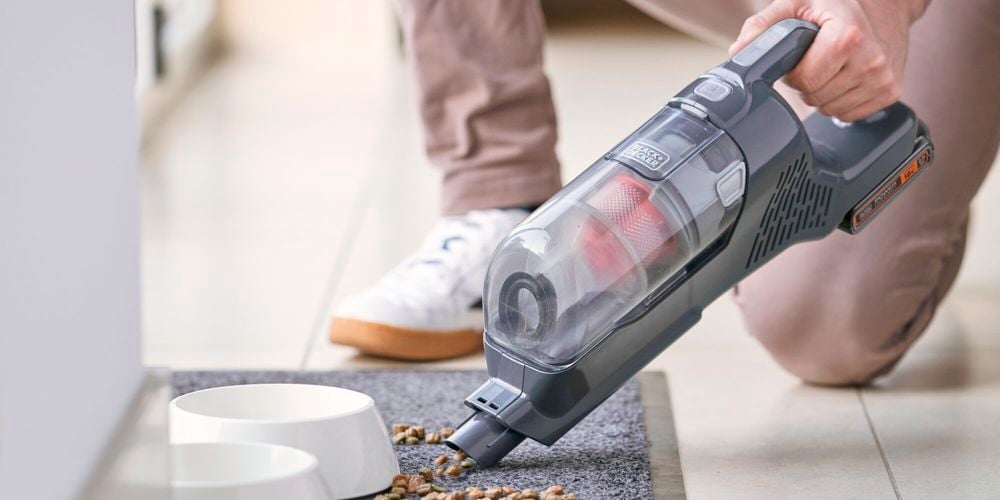 Stick vac from back and decker being used in house cleaning