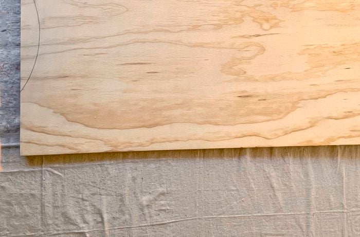 Piece of wood with sketched curve line