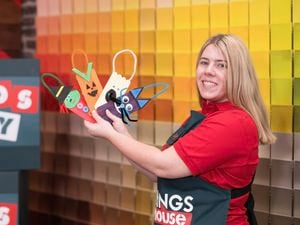 A Bunnings Team Member is holding spooky Halloween popsicle character​​