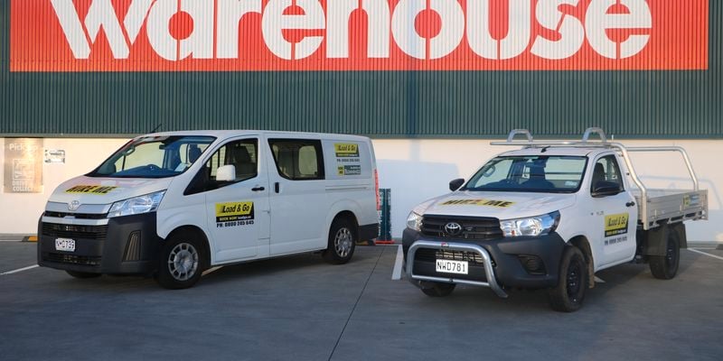 A van and a ute parked outside a Bunnings store