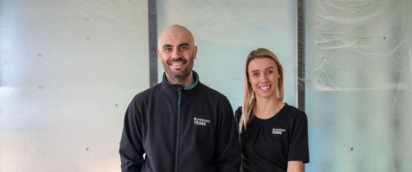Two bunnings trade team members inside a building