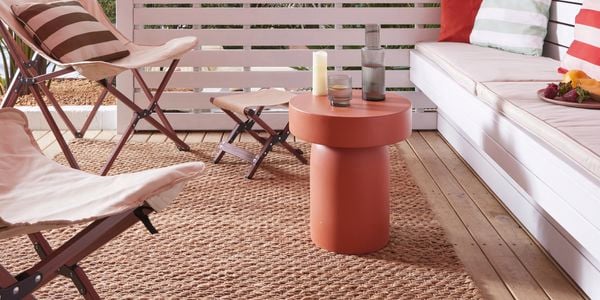 Outdoor setting on back alfresco area with accents of white and stained timber
