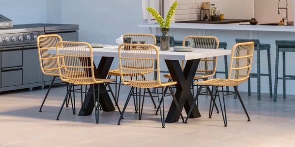 Outdoor wicker set on grey pavers