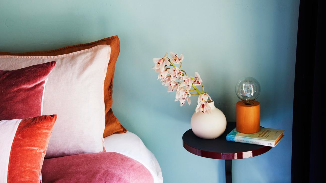 Cosy bedroom styled with a cool colour palette