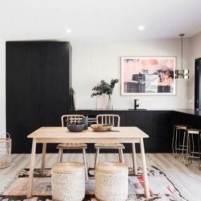 Interior kitchen with black cabinetry.
