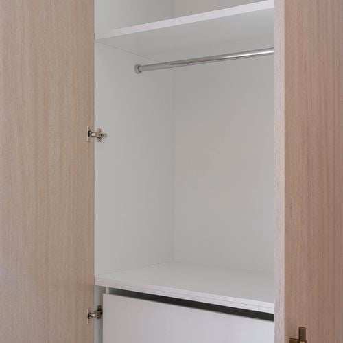 CUSTOMpine cabinetry with clothes rain in shot