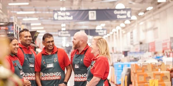 Bunnings team members laughing.