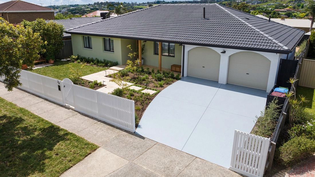 Green house with white garage